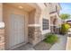 Close-up view of the home's inviting entrance, featuring stone accents at 89 Day Trade St # 1, Henderson, NV 89074