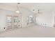 Bright, spacious living room with large windows and neutral tones at 89 Day Trade St # 1, Henderson, NV 89074