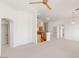 Open-concept living room with a ceiling fan and views of the kitchen at 89 Day Trade St # 1, Henderson, NV 89074