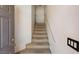 A clean staircase leading to the upper levels of the residence at 89 Day Trade St # 1, Henderson, NV 89074