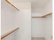 A simple walk-in closet featuring white walls and wooden support poles at 89 Day Trade St # 1, Henderson, NV 89074