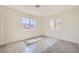 Sunlit bedroom featuring two windows providing ample natural light and pleasant views of the outdoors at 9722 Rocket Grove Ct, Las Vegas, NV 89178