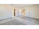 Bright bedroom with neutral walls, gray carpet, and walk-in closet provides a versatile space for relaxation and personalization at 9722 Rocket Grove Ct, Las Vegas, NV 89178