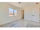Bright bedroom features a window and convenient door leading to another room, perfect for a functional and flexible living space at 9722 Rocket Grove Ct, Las Vegas, NV 89178