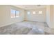 Spacious carpeted bedroom with three windows providing ample natural light at 9722 Rocket Grove Ct, Las Vegas, NV 89178