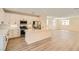 Bright kitchen boasts white cabinets, modern appliances, marble countertops and a central island with seating at 9722 Rocket Grove Ct, Las Vegas, NV 89178