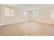 Expansive living room featuring sleek flooring, abundant natural light, and an open design, perfect for modern living at 9722 Rocket Grove Ct, Las Vegas, NV 89178