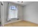 Bright bedroom with a large window featuring blind and curtain accents for ample natural light at 9864 Maspalomas St, Las Vegas, NV 89178