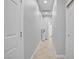 Bright hallway with neutral walls, tile flooring, and a built-in storage cabinet at 9864 Maspalomas St, Las Vegas, NV 89178