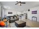 Open-concept living room and kitchen with stainless steel appliances, a spacious island, and tile flooring at 9864 Maspalomas St, Las Vegas, NV 89178