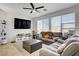 Comfortable living room featuring abundant natural light, stylish furnishings, and a warm, inviting atmosphere at 9864 Maspalomas St, Las Vegas, NV 89178