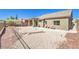 Desert landscaped backyard with covered patio and drought-tolerant plantings for easy upkeep at , Las Vegas, NV 89122