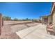 Private backyard space with covered patio, desert landscaping, and wrought iron fencing at , Las Vegas, NV 89122