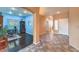 Open hallway featuring a home office and doorway to the front door at , Las Vegas, NV 89122