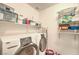 Neat laundry room equipped with a washer, dryer, and shelving for ample storage at , Las Vegas, NV 89122