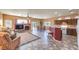 Open-concept living room with fireplace, tile flooring, and easy access to kitchen and outdoor patio at , Las Vegas, NV 89122