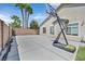 Spacious backyard with a basketball hoop and concrete pad, providing ample space for recreation at 10325 Sweet Fennel Dr, Las Vegas, NV 89135