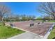 Outdoor bocce ball court with seating and lush landscaping under a clear blue sky for a resort-style experience at 10325 Sweet Fennel Dr, Las Vegas, NV 89135