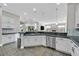 A modern kitchen with stainless steel appliances, granite countertops and ample cabinetry at 10325 Sweet Fennel Dr, Las Vegas, NV 89135