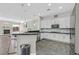 Modern kitchen featuring stainless steel appliances, granite countertops, and a convenient breakfast bar at 10325 Sweet Fennel Dr, Las Vegas, NV 89135