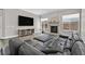 Cozy living room featuring a stone fireplace, plush seating, and a mounted TV at 10325 Sweet Fennel Dr, Las Vegas, NV 89135