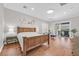 Bright main bedroom with hardwood flooring and private outdoor access at 10325 Sweet Fennel Dr, Las Vegas, NV 89135