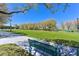 Beautiful park featuring a wide-open green space, walking trails, benches, and mature shade trees at 10325 Sweet Fennel Dr, Las Vegas, NV 89135