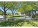 Scenic park with lush green grass, mature trees, walking paths, and a shaded pergola, perfect for leisurely strolls at 10325 Sweet Fennel Dr, Las Vegas, NV 89135