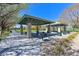 Outdoor picnic area with covered pavilion, BBQ grills, and tables providing a space for gatherings at 10325 Sweet Fennel Dr, Las Vegas, NV 89135