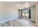 This quiet bedroom offers luxury vinyl floors and a bright window at 1038 Silver Creek Ave, Las Vegas, NV 89183