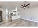An expansive view of the home's kitchen, living, and dining areas provides an open feeling at 1038 Silver Creek Ave, Las Vegas, NV 89183