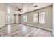 Bright living room with luxury vinyl flooring and natural light from large windows at 1038 Silver Creek Ave, Las Vegas, NV 89183
