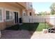 Fenced backyard featuring artificial turf and gravel at 1081 Elation Ln # 2, Henderson, NV 89002