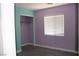 Bedroom with unique color scheme, window, and carpet, creating a cozy atmosphere at 1081 Elation Ln # 2, Henderson, NV 89002