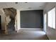 Spacious room featuring a staircase and a sliding glass door to the backyard at 1081 Elation Ln # 2, Henderson, NV 89002