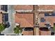 Overhead perspective of residential rooftops, highlighting tile textures and solar panels at 10918 Avenzano St, Las Vegas, NV 89141