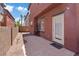 Enclosed backyard with a concrete patio and desert landscaping at 10918 Avenzano St, Las Vegas, NV 89141
