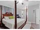 Elegant bedroom featuring a four-poster bed and a seating bench at 10918 Avenzano St, Las Vegas, NV 89141