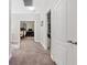 Carpeted hallway leading to a bedroom, showing a cozy and accessible layout at 10918 Avenzano St, Las Vegas, NV 89141
