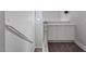 Upstairs hallway featuring a decorative half-wall and a built-in storage cabinet at 10918 Avenzano St, Las Vegas, NV 89141