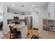 Bright kitchen features white cabinets, stainless steel appliances, granite countertops, and tiled floors at 10918 Avenzano St, Las Vegas, NV 89141