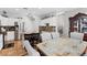Bright kitchen and dining area with white cabinets, stainless appliances, and a dining table at 10918 Avenzano St, Las Vegas, NV 89141