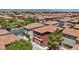 Residential neighborhood showcasing uniform homes with tile roofs amidst lush greenery at 10918 Avenzano St, Las Vegas, NV 89141