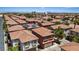 View of a vibrant neighborhood with tile roofs and well-maintained landscaping at 10918 Avenzano St, Las Vegas, NV 89141