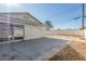 Large concrete patio next to the house with access through a sliding glass door at 1108 Princess Katy Ave, Las Vegas, NV 89119