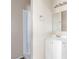 The simple bathroom features white fixtures, a shower, and a small mirror at 1108 Princess Katy Ave, Las Vegas, NV 89119