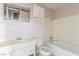 Compact bathroom featuring white tile, a bathtub, and white fixtures at 1108 Princess Katy Ave, Las Vegas, NV 89119