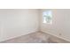 Bedroom featuring carpeted floors and a window allowing for natural light at 1108 Princess Katy Ave, Las Vegas, NV 89119