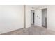 Bedroom features carpeted floors with a closet and view to a bathroom at 1108 Princess Katy Ave, Las Vegas, NV 89119