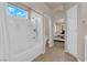 Bathroom with a tub shower combo, vanity and linen storage at 11139 Zarod Rd, Las Vegas, NV 89135